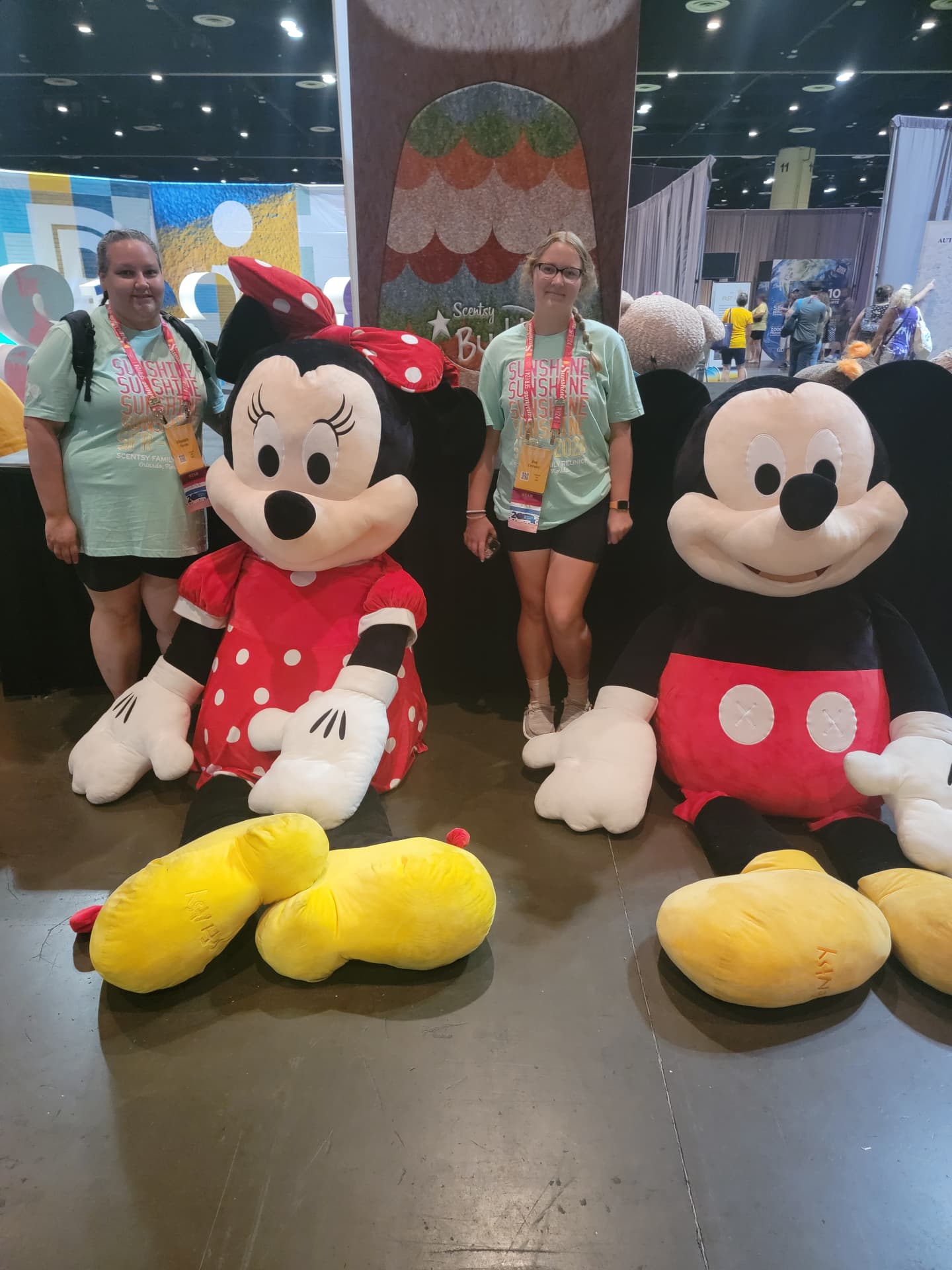 Elizabeth at Scentsy Family Reunion with the giant Mickey and Minnie Buddies